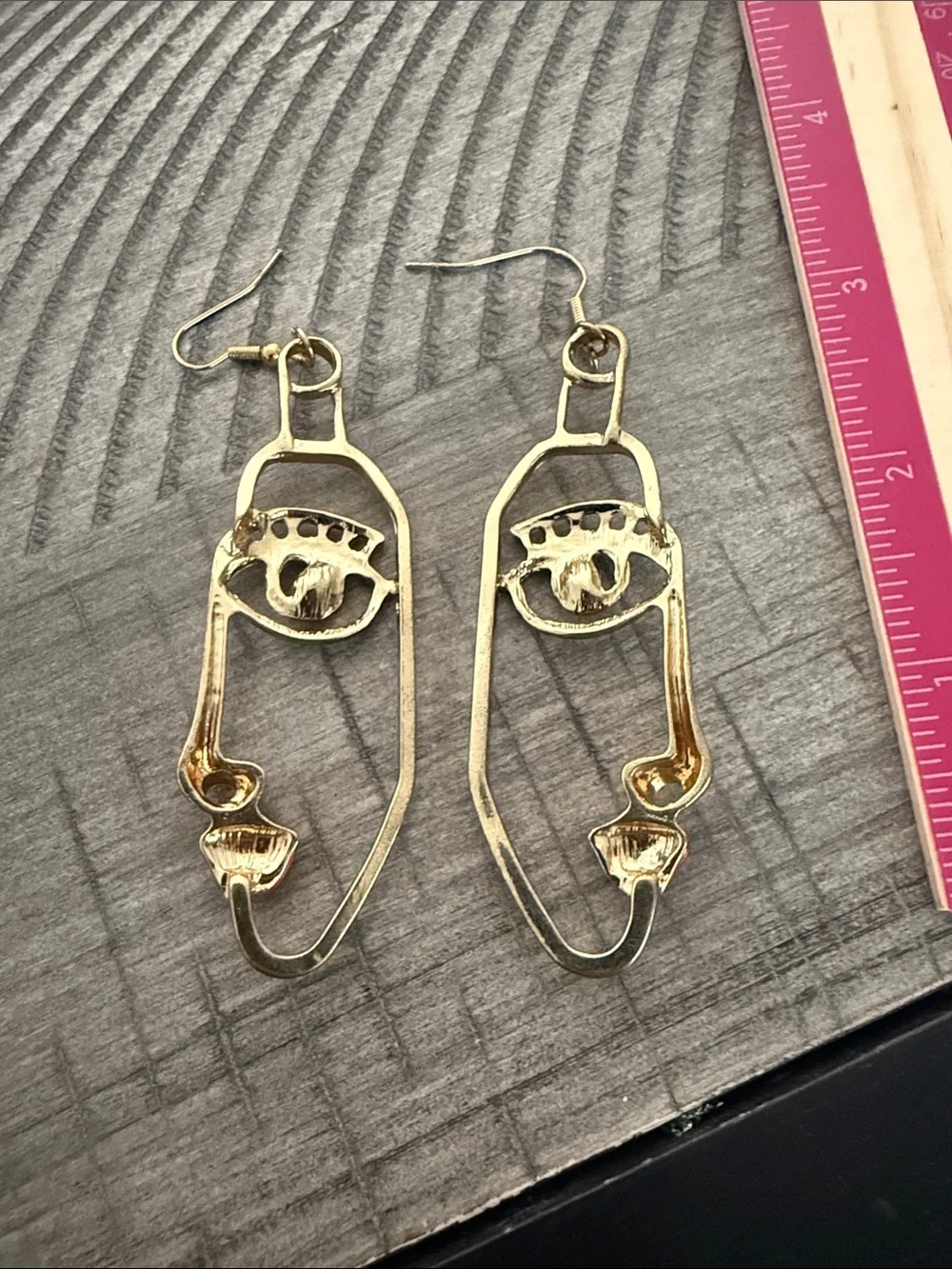 Gold Face Outline Drop Earrings with Blue and Red Accents
